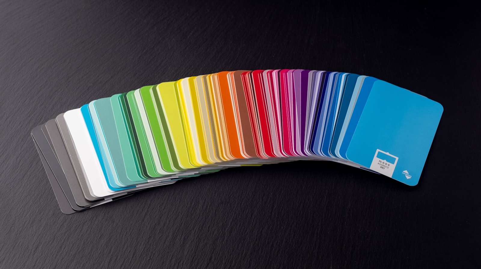 Stack of colorful plastic cards on a desk